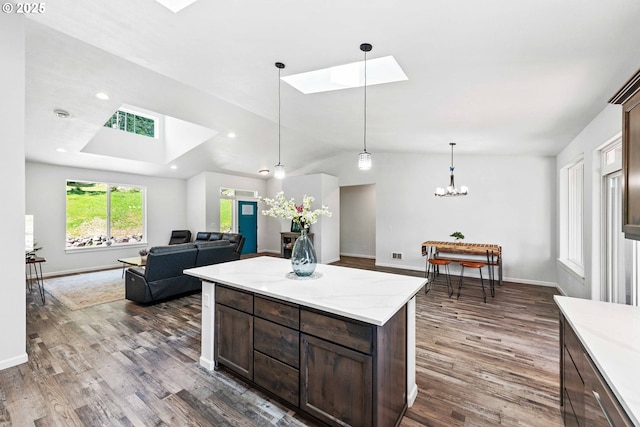 69857 Stage Rd, North Bend, OR 97459 - kitchen with a skylight, dark wood-style floors, a chandelier, dark brown cabinets, and vaulted ceiling