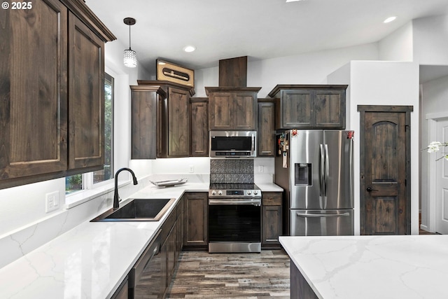 69857 Stage Rd, North Bend, OR 97459 - kitchen featuring stainless steel appliances, a sink, healthy amount of natural light, wood finished floors, and recessed lighting