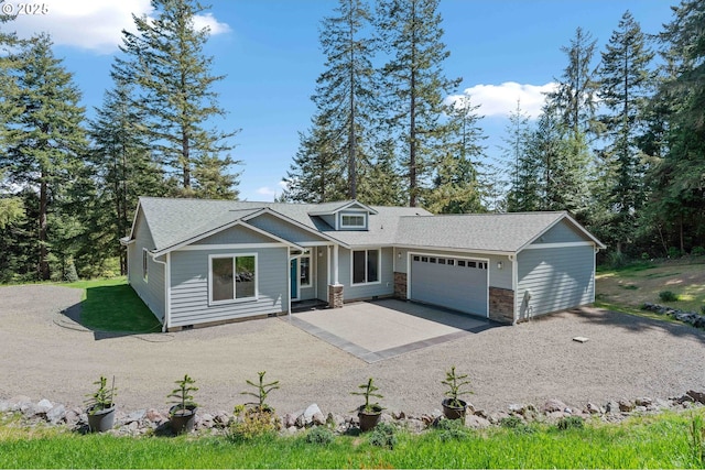 69857 Stage Rd, North Bend, OR 97459 - view of front of house featuring dirt driveway, an attached garage, stone siding, and a shingled roof