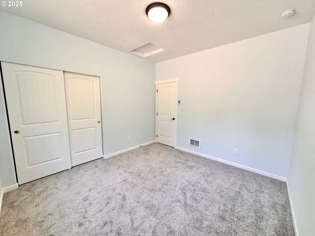 69857 Stage Rd, North Bend, OR 97459 - unfurnished bedroom with carpet, baseboards, and a closet