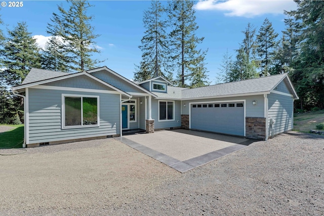 69857 Stage Rd, North Bend, OR 97459 - view of front of house with a garage, driveway, stone siding, and roof with shingles