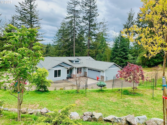 69857 Stage Rd, North Bend, OR 97459 - view of front facade featuring an attached garage, concrete driveway, a front lawn, and stone siding