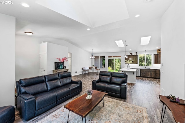 69857 Stage Rd, North Bend, OR 97459 - living room with a skylight, dark wood-style flooring, recessed lighting, and vaulted ceiling