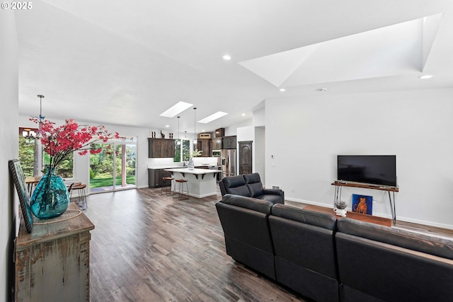 69857 Stage Rd, North Bend, OR 97459 - living area with vaulted ceiling, dark wood-style flooring, a skylight, a chandelier, and recessed lighting