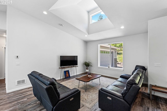 69857 Stage Rd, North Bend, OR 97459 - living room with healthy amount of natural light, a skylight, wood finished floors, and recessed lighting