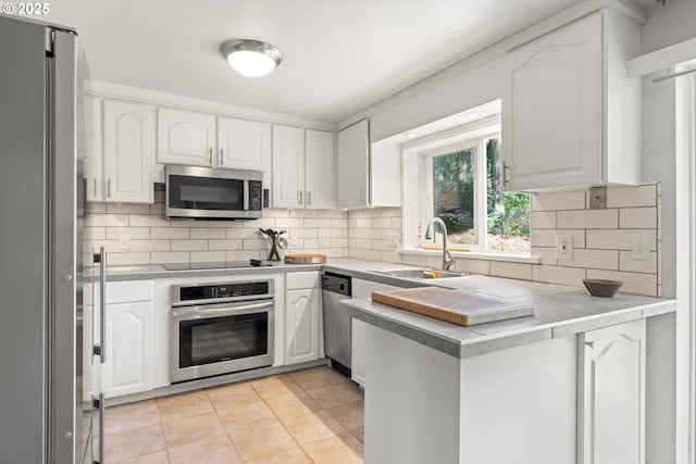 1725 Southshore Blvd, Lake Oswego, OR 97034 - kitchen with stainless steel appliances, white cabinets, and tasteful backsplash