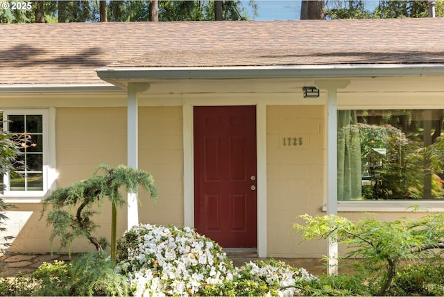 1725 Southshore Blvd, Lake Oswego, OR 97034 - doorway to property featuring roof with shingles and concrete block siding