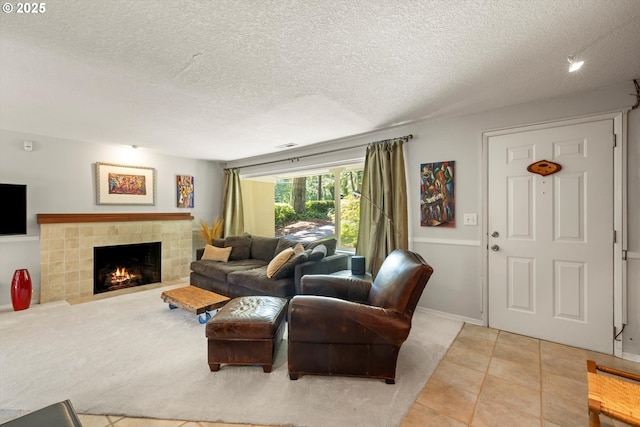 1725 Southshore Blvd, Lake Oswego, OR 97034 - living room with a textured ceiling, a tiled fireplace, and tile patterned floors