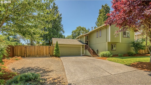 10840 SW Black Diamond Way, Portland, OR 97223 - view of front facade featuring a garage, concrete driveway, and stairs