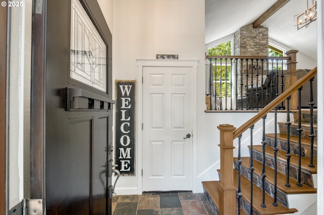 10840 SW Black Diamond Way, Portland, OR 97223 - entrance foyer with baseboards, dark stone finish flooring, and stairway