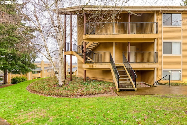 rear view of property with a yard