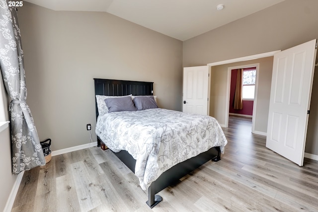 10955 SW 130th Ave, Tigard, OR 97223 - bedroom with vaulted ceiling and light wood finished floors