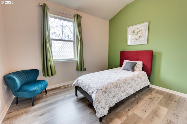 10955 SW 130th Ave, Tigard, OR 97223 - bedroom with multiple windows, lofted ceiling, and wood finished floors