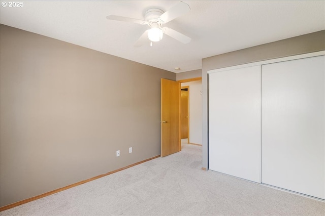 1224 Alyssum Ave, Forest Grove, OR 97116 - unfurnished bedroom featuring light colored carpet, baseboards, a ceiling fan, and a closet