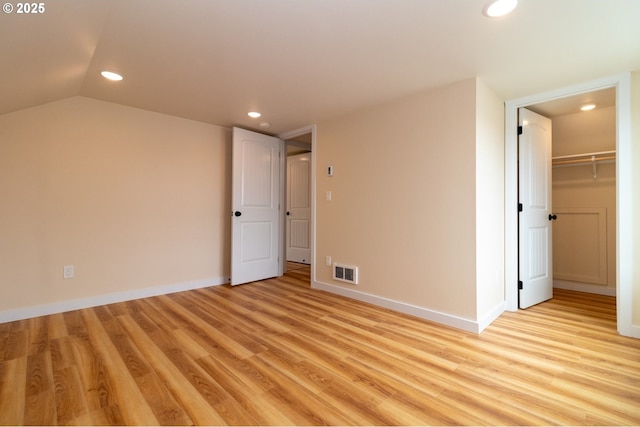 unfurnished bedroom featuring recessed lighting, baseboards, visible vents, and light wood-type flooring