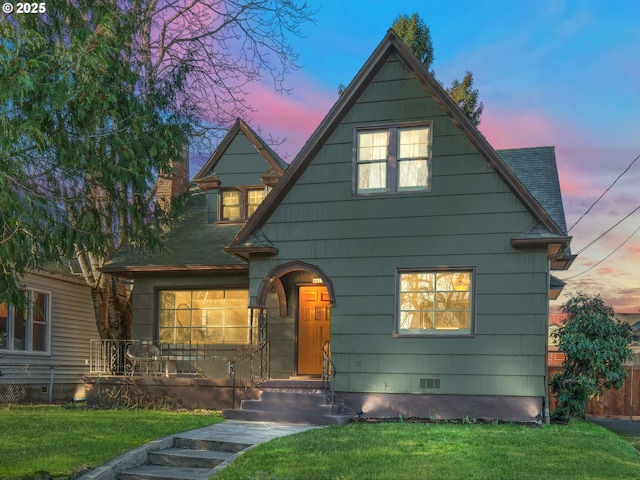 view of front of house with a lawn