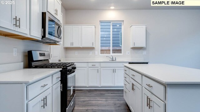 2131 NE 3rd Ave, Battle Ground, WA 98604 - kitchen featuring appliances with stainless steel finishes, a sink, recessed lighting, white cabinets, and light countertops