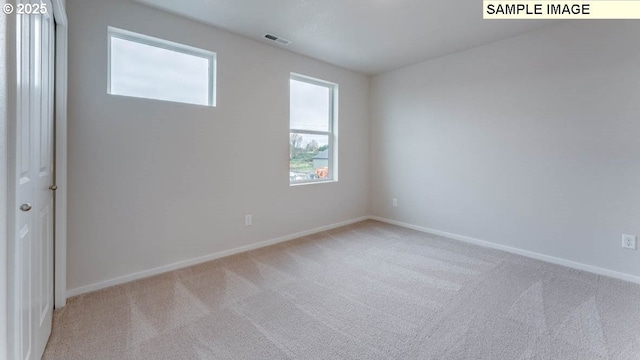 2131 NE 3rd Ave, Battle Ground, WA 98604 - spare room featuring carpet and baseboards