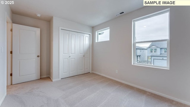 2131 NE 3rd Ave, Battle Ground, WA 98604 - unfurnished bedroom featuring carpet floors, baseboards, and a closet
