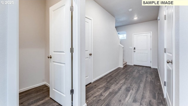 2131 NE 3rd Ave, Battle Ground, WA 98604 - hallway featuring dark wood-style flooring, baseboards, stairs, and recessed lighting