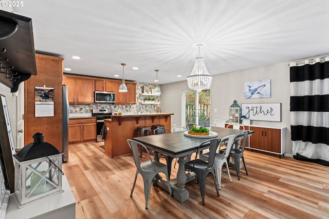 dining room with light wood-type flooring