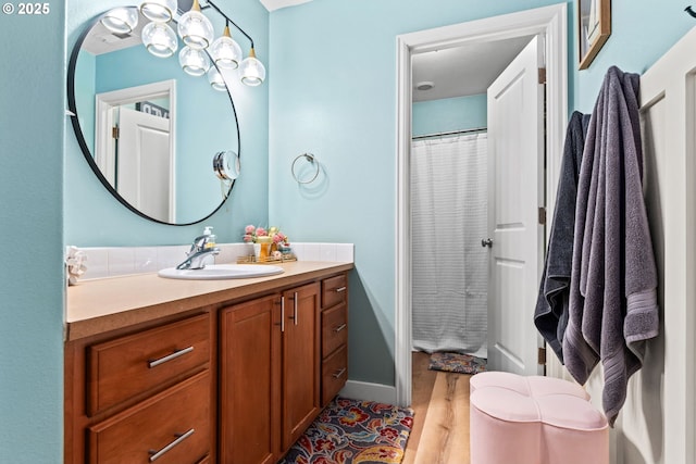 bathroom featuring vanity and wood-type flooring