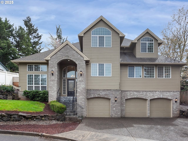 3808 Fairhaven Dr, West Linn, OR 97068 - view of front of house featuring brick siding, driveway, an attached garage, and a shingled roof
