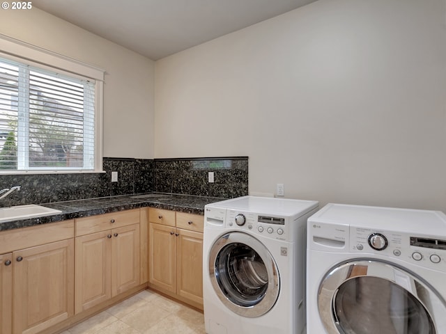 3808 Fairhaven Dr, West Linn, OR 97068 - washroom with washer and dryer, cabinet space, and light tile patterned flooring
