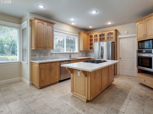 3808 Fairhaven Dr, West Linn, OR 97068 - kitchen featuring appliances with stainless steel finishes, a center island, tasteful backsplash, healthy amount of natural light, and recessed lighting