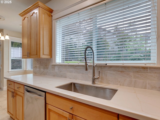 3808 Fairhaven Dr, West Linn, OR 97068 - kitchen with stainless steel dishwasher, light brown cabinetry, light stone counters, decorative backsplash, and light tile patterned floors