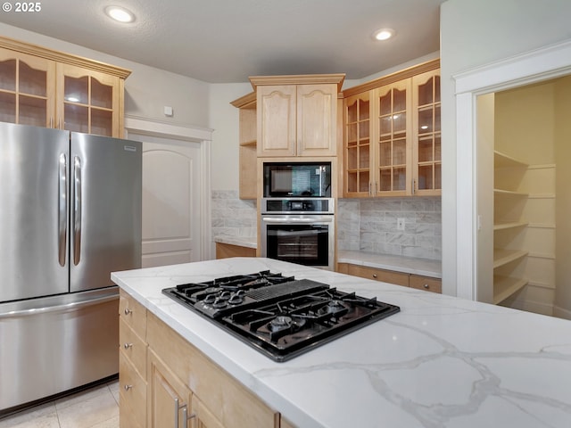3808 Fairhaven Dr, West Linn, OR 97068 - kitchen with black appliances, light brown cabinets, glass insert cabinets, light stone counters, and backsplash
