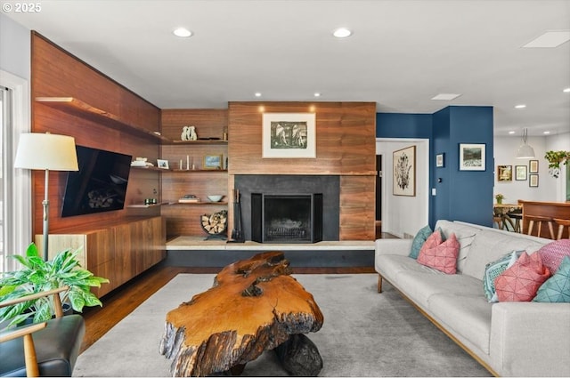 2975 SW Canterbury Ln, Portland, OR 97205 - living room with wood finished floors, recessed lighting, and a fireplace with raised hearth