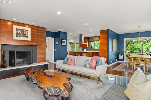 2975 SW Canterbury Ln, Portland, OR 97205 - living room with baseboards, recessed lighting, wood finished floors, and a fireplace with raised hearth