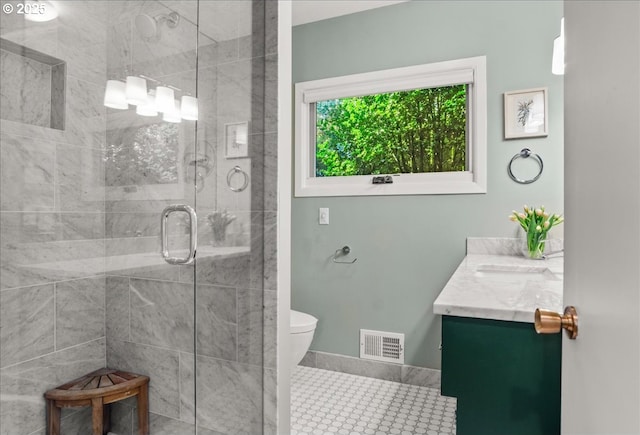 2975 SW Canterbury Ln, Portland, OR 97205 - bathroom featuring vanity, a shower stall, toilet, and baseboards