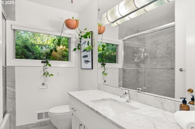 2975 SW Canterbury Ln, Portland, OR 97205 - bathroom with vanity, plenty of natural light, an enclosed shower, and toilet