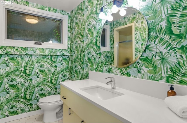 2975 SW Canterbury Ln, Portland, OR 97205 - bathroom with wallpapered walls, vanity, tile patterned floors, toilet, and an enclosed shower