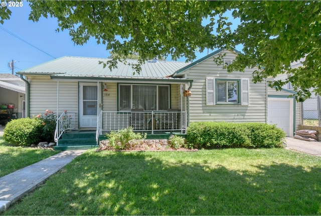 104 NW 12th St, Pendleton, OR 97801 - ranch-style house featuring a porch, a front yard, a metal roof, and an attached garage