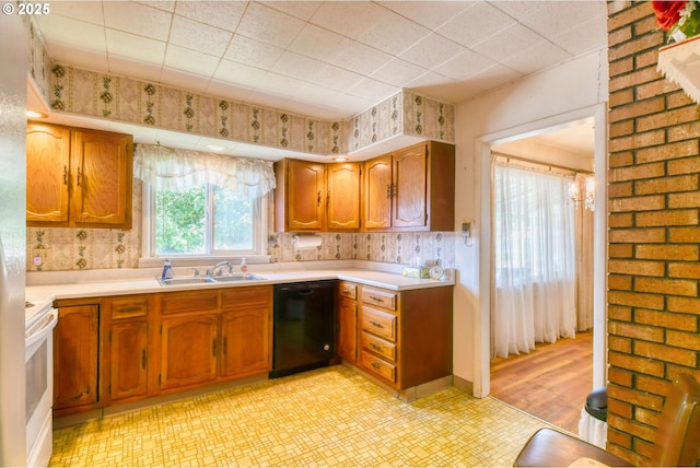 104 NW 12th St, Pendleton, OR 97801 - kitchen featuring dishwasher, white range with electric stovetop, light countertops, light flooring, and brown cabinets