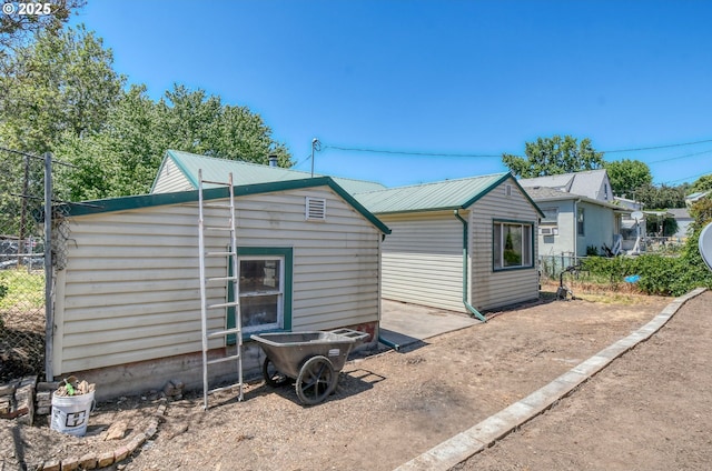 104 NW 12th St, Pendleton, OR 97801 - rear view of house with an outdoor structure and a metal roof