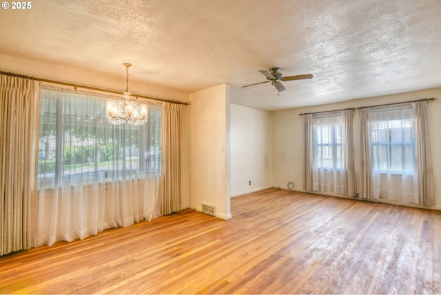 104 NW 12th St, Pendleton, OR 97801 - unfurnished room featuring wood finished floors, a textured ceiling, a chandelier, and ceiling fan