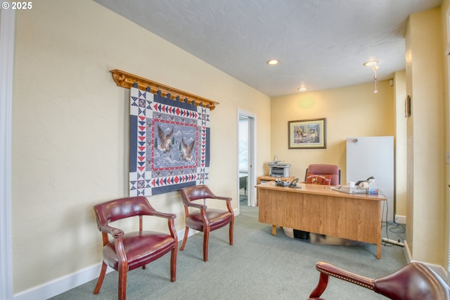 home office with carpet and a textured ceiling