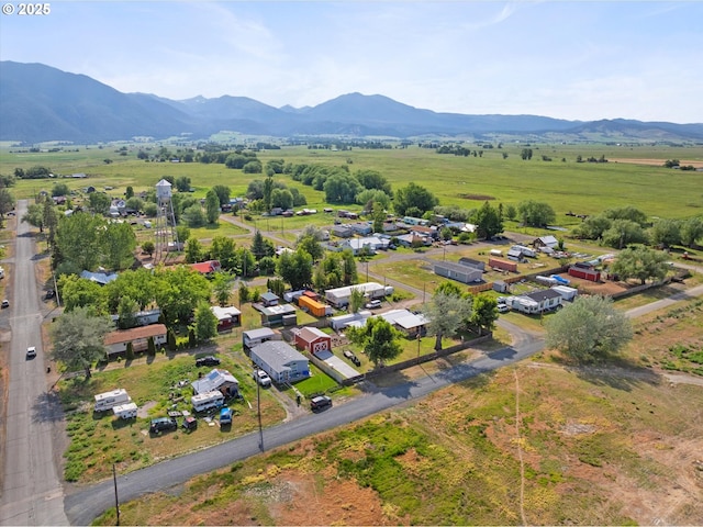 aerial view of sparsely populated area featuring a mountainous background