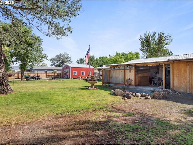 view of yard with an outdoor structure and an outbuilding
