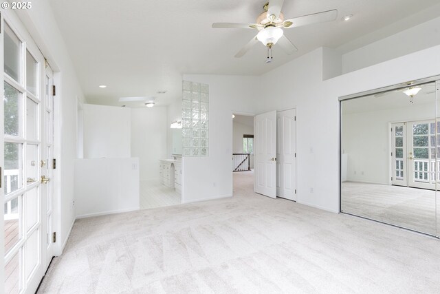 unfurnished bedroom featuring recessed lighting, french doors, baseboards, and carpet