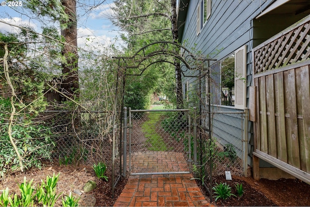 view of gate with fence