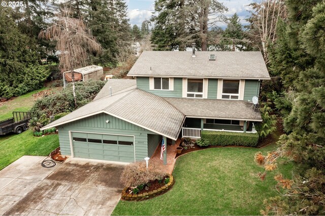 view of front facade with driveway, a porch, a front yard, a shingled roof, and a garage