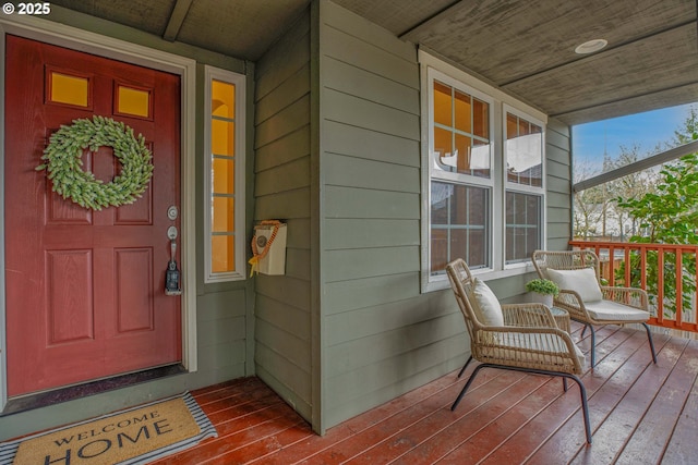 doorway to property featuring covered porch