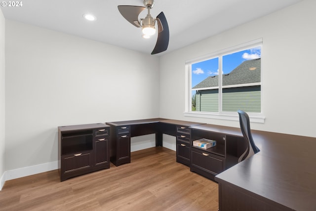 office area with light hardwood / wood-style floors and ceiling fan