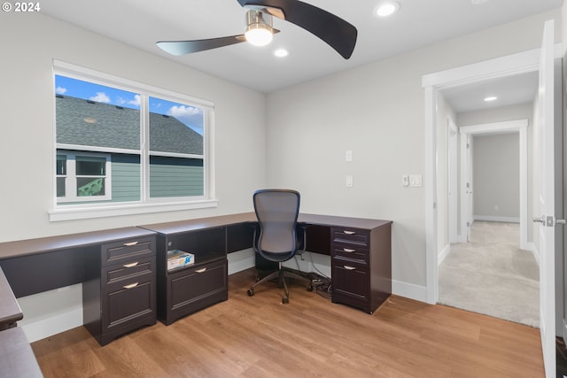 office space with ceiling fan and light wood-type flooring