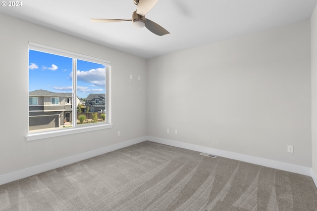 carpeted empty room with ceiling fan